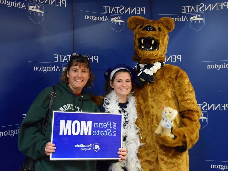 Mother and daughter posing with Nittany lion at Penn State Abington near Philadelphia